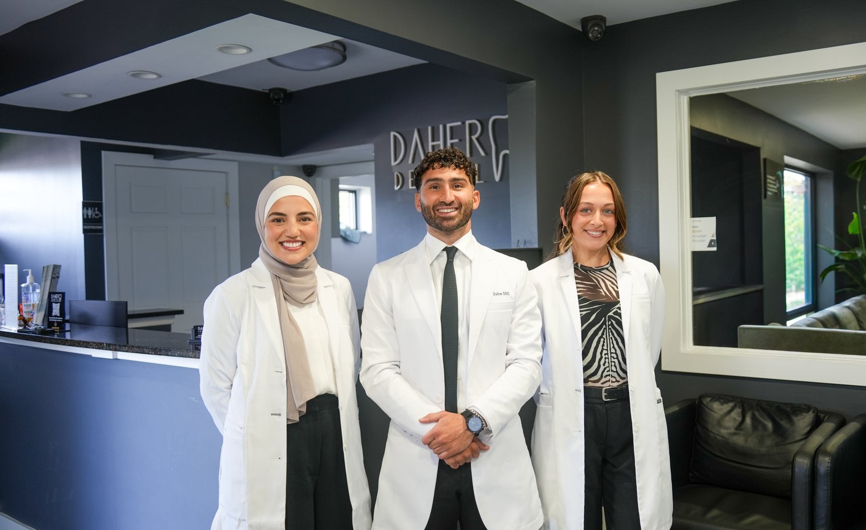 Dr. Hussein Daher, Dr. Hannah and Dr. Houda at the Daher Dental front desk